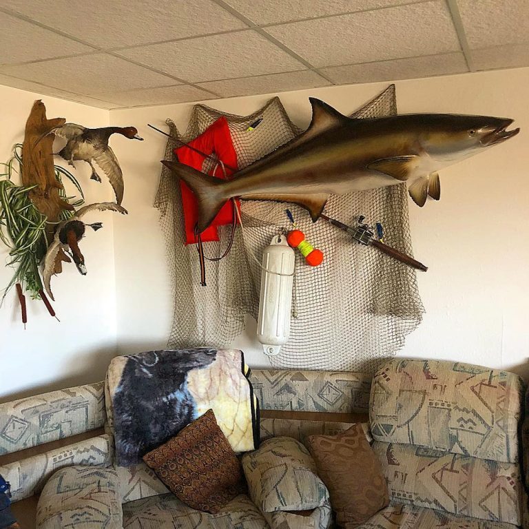 LodgeFreeport TX Fishing Charters lodge decor - stuffed fish over couch